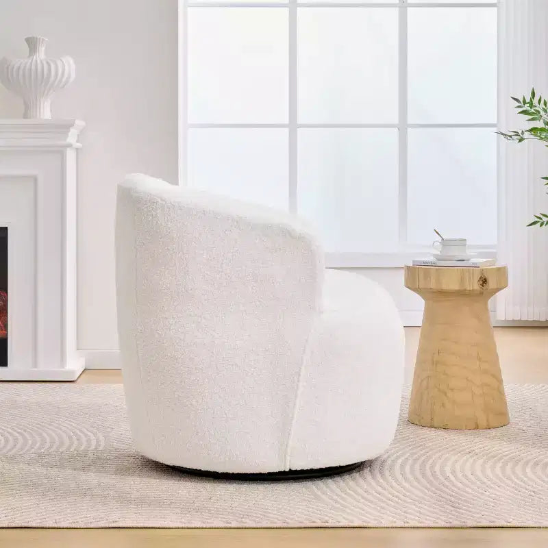 Poltrona girevole Teddy con rivestimento in tessuto e schienale ergonomico per soggiorno